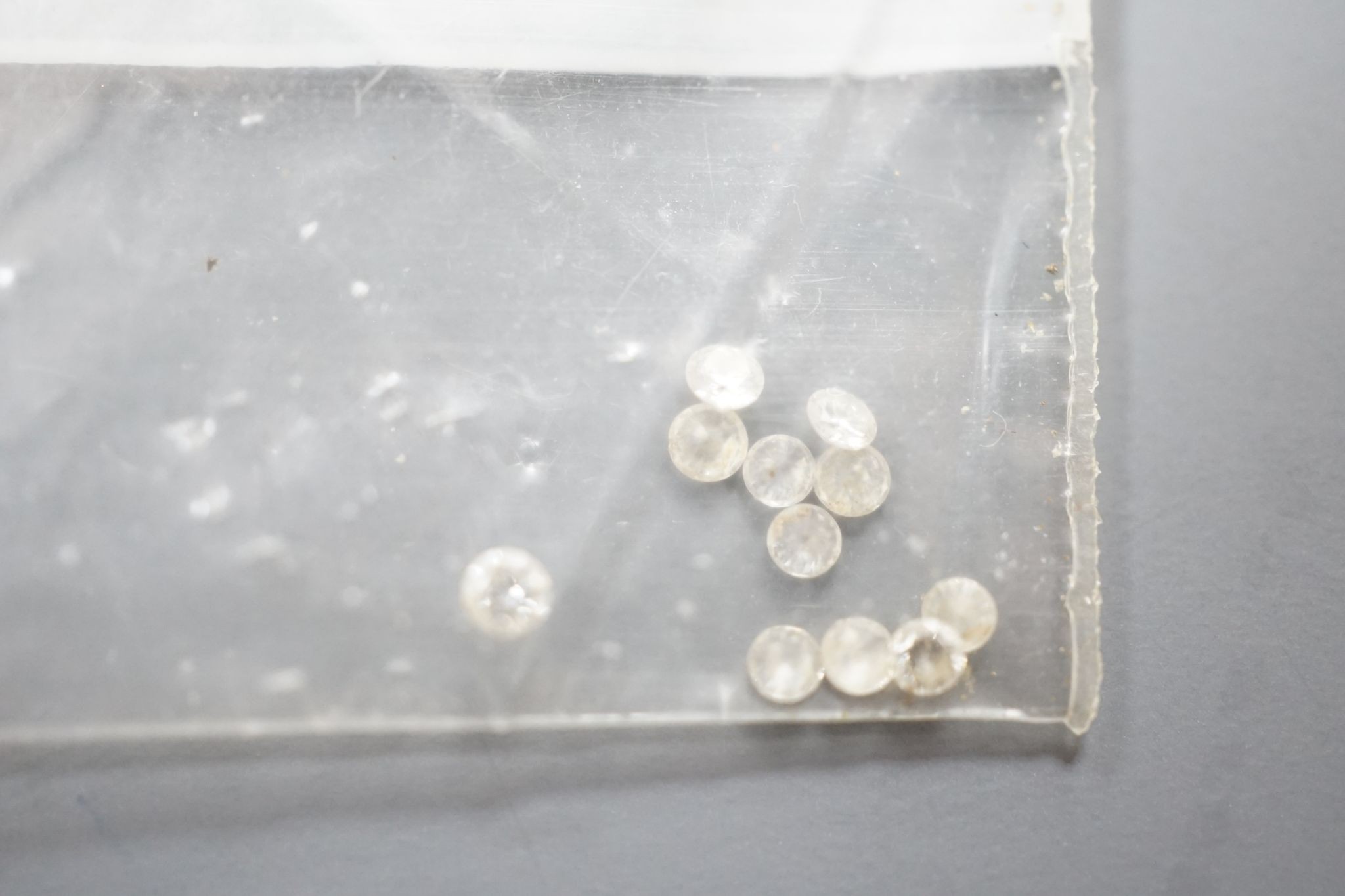 Fourteen small unmounted cut diamonds, total weight approx. 0.58ct.